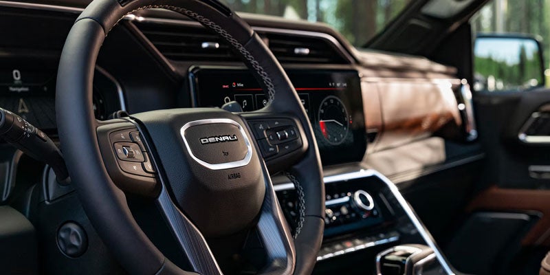 2026 GMC Sierra 1500 Denali steering wheel with premium interior and digital driver display